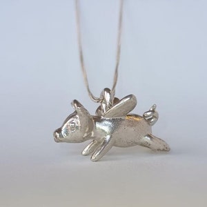 Sterling Silver Flying Pig pendant with 19 inch Sterling silver chain