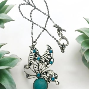 Boho Butterfly Pendant Necklace – Silver Filigree with Turquoise Stone and Blue Rhinestones, Nature-Inspired Statement Jewelry
