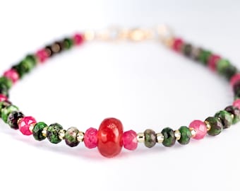 Ruby Zoisite bracelet with extra ruby microfaceted beads that have tiny Mikuji beads incorporated between the beads.