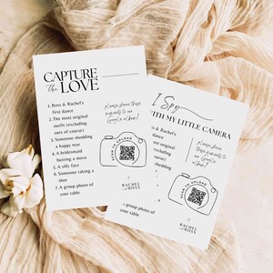 May include: Two white cards with black text and illustrations. The first card has the text "Capture the Love" and a list of seven things to photograph at a wedding. The second card has the text "I Spy "With My Little Camera" and a list of things to find in wedding photos. Both cards have a QR code and the text "Scan to Upload".