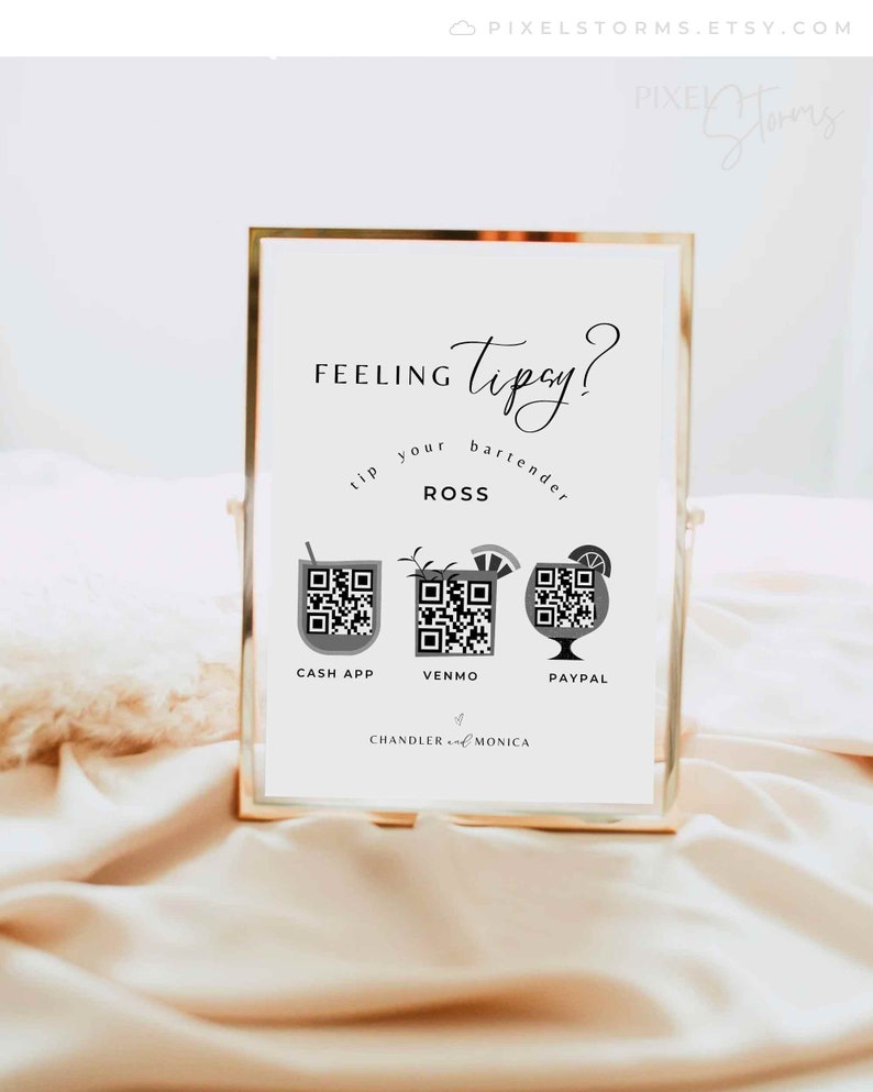 May include: A white sign with gold trim, featuring the text "Feeling Tipsy? Tip your bartender ROSS" with three QR codes for Cash App, Venmo, and Paypal. The sign also includes the text "Chandler and Monica".