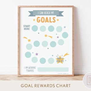 May include: A printable chart with a blue and yellow star design. The chart is titled "I can reach my *GOALS*" and has a series of circles to mark progress towards a goal. The chart also includes the text "START HERE" and "YAY! DID IT!"