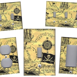 May include: Set of five light switch and outlet covers featuring a vintage-style treasure map with a skull and crossbones, compass, and the text "ATLANTIS CHE" and "TREASURE MAP".