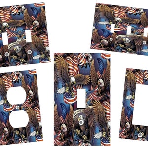 May include: Set of five light switch and outlet covers featuring a patriotic design with bald eagles and American flags. The covers are printed with a realistic image of bald eagles soaring above waving American flags.