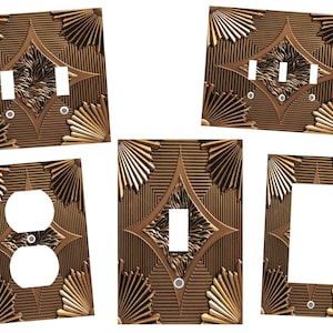 May include: Set of five decorative wall plates with a geometric pattern and a gold finish. The plates feature different switch and outlet configurations.