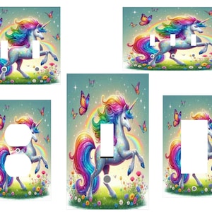 May include: A set of light switch and outlet covers featuring a colorful unicorn with a rainbow mane and tail, standing in a field of flowers with butterflies.