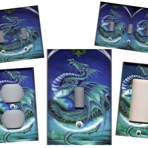 May include: Decorative light switch covers featuring a fantasy dragon design. The dragon is depicted in shades of green and blue against a dark blue background. The covers come in various configurations, including single and double switch plates, and an outlet cover.