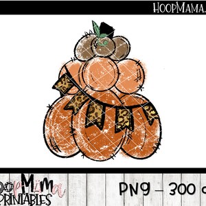 May include: A stack of orange pumpkins with a leopard print ribbon and a green leaf on top. The pumpkins have a distressed, vintage look.