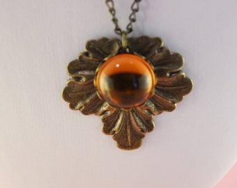 Kette mit Blatt und orangem Cabochon