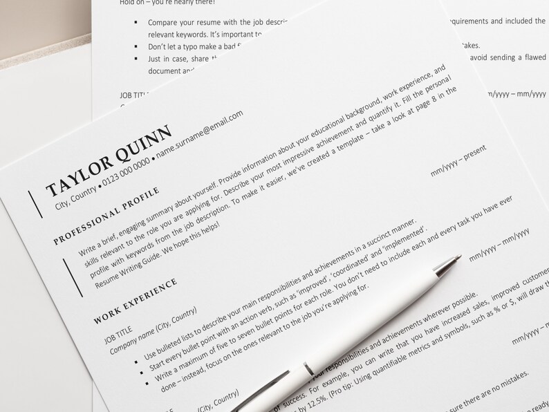 May include: A close-up of a resume with the heading "Taylor Quinn" and contact information. The resume includes a professional profile section and a work experience section.