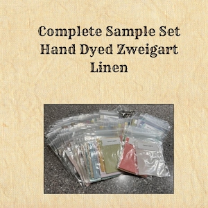 May include: A complete sample set of hand-dyed Zweigart linen fabric swatches. The swatches are arranged in a clear plastic bag and include a variety of colours.