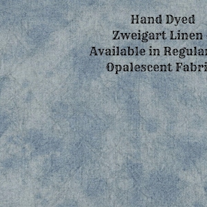 May include: Hand dyed Zweigart linen, available in regular and opalescent fabrics. The linen is a light blue color with a textured surface.