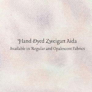 May include: Close-up of a textured fabric with the text "Hand Dyed Zweigart Aida" and "Available in Regular and Opalescent Fabrics". The fabric has a subtle, multi-colored pattern.