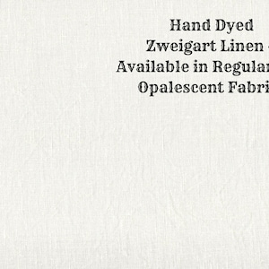 Könnte beinhalten: Off-white Zweigart Leinenstoff, handgefärbt und in regulären und opalisierenden Ausführungen erhältlich. Der Text auf dem Bild lautet: Hand Dyed Zweigart Linen ~ Available in Regular and Opalescent Fabrics.