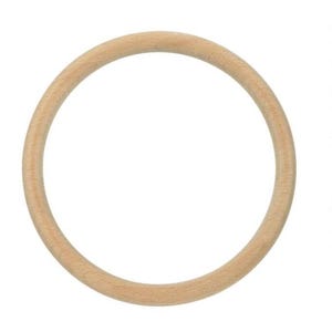 May include: A smooth, circular wooden ring with a light tan, natural grain finish. The object is a simple, unadorned hoop with a consistent thickness throughout its entire circumference, showcasing the organic texture of the light-colored wood.