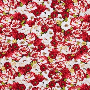 May include: A fabric with a dense floral pattern. The design features a mix of red and white flowers with green leaves and yellow accents. The flowers are in various stages of bloom, creating a textured look.