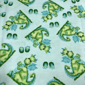Green Dragons Flannel Fabric from A.E. Nathan ~ 100% cotton brushed for softness light turquoise background