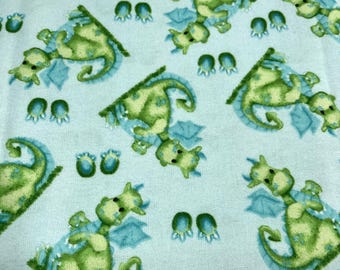 PER YARD ~ A.E. Nathan Cotton Flannel Green Dragons Fabric ~ 100% cotton - brushed for softness turquoise background