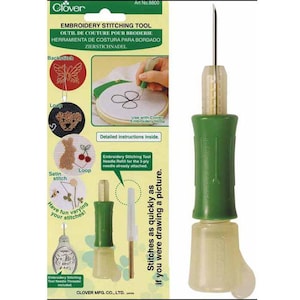May include: A Clover brand embroidery stitching tool with a green handle and a metal needle tip. The packaging features instructional diagrams, text including 'Embroidery Stitching Tool', and illustrations of various stitch types and patterns.