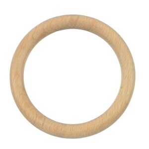 May include: A circular ring crafted from light-colored natural wood with a smooth, sanded finish. The object features a consistent, rounded profile throughout its entire circumference, showcasing the subtle grain patterns of the wood material.
