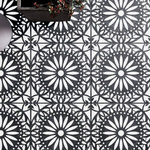May include: Black and white patterned floor tiles with a repeating floral design. The tiles are arranged in a grid pattern.