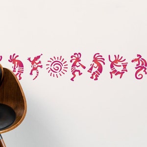 May include: A white wall with a row of pink and red stylized figures, including a sun, a lizard, and dancers. A black leather chair with wooden legs is in the foreground.