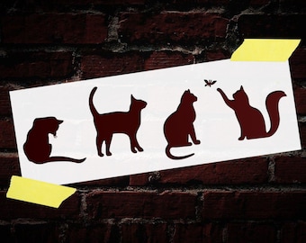 Könnte beinhalten: Eine weiße Schablone mit vier schwarzen Katzen-Silhouetten. Die Katzen sind in verschiedenen Posen dargestellt, darunter sitzend, stehend und ein Schmetterling jagend.