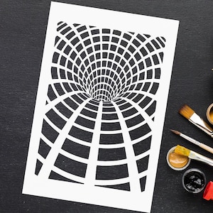 May include: A white stencil with a black and white optical illusion design of a tunnel or vortex. The stencil is on a white sheet of paper, with paintbrushes and paint pots visible on a black surface.