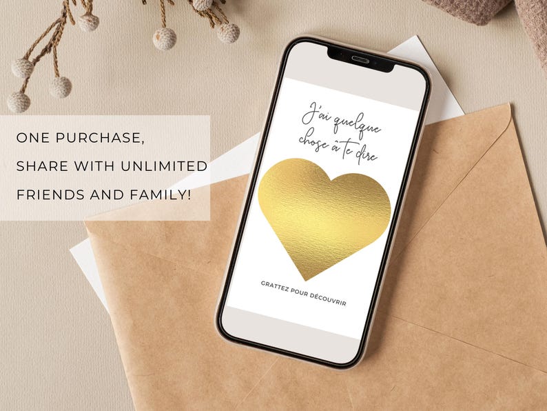 May include: A gold heart scratch-off card with the text "J'ai quelque chose &agrave; te dire" and "GRATTEZ POUR D&Eacute;COUVRIR" in French. The card is on a white background.