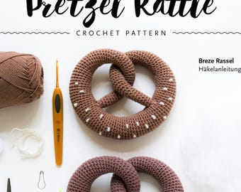 Crochet pattern for a baby rattle pretzel – Crochet an amigurumi rattle – PDF instructions in German & English – Baby toy for birth or baby shower – Tutorial