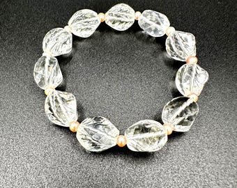 Elastic crystal bracelet adorned with genuine, delicate pink cultured pearls; high-quality vintage jewelry piece.