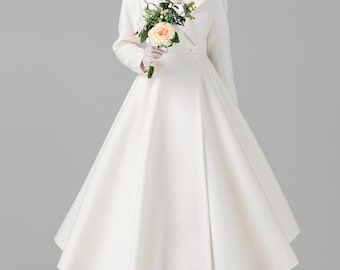 May include: A white, double-breasted coat with a flared skirt, worn over a lace-trimmed top. The coat features a classic collar and is paired with white gloves and high heels. A bouquet of flowers adds a touch of color.