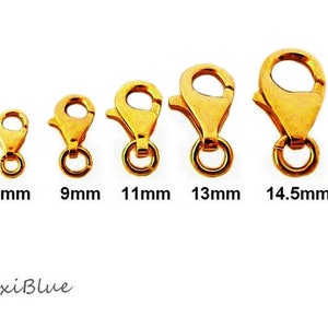 K&ouml;nnte beinhalten: F&uuml;nf goldfarbene Karabinerverschl&uuml;sse in verschiedenen Gr&ouml;&szlig;en von 7 mm bis 14,5 mm. Die Verschl&uuml;sse sind vor einem wei&szlig;en Hintergrund abgebildet.