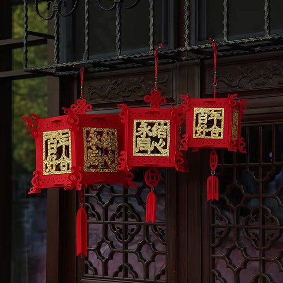 Chinese spring festival decorations displaying red lanterns and couplets in 2025