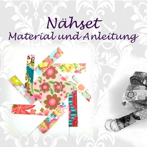 Könnte beinhalten: Ein Nähset mit dem Text "Nähset Material und Anleitung" in Lila. Das Set enthält bunte Stoffreste und eine Stoffrolle.