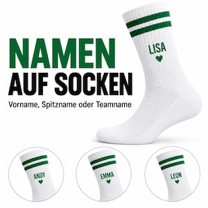 May include: White crew socks featuring two horizontal green stripes at the top and the green text LISA above a small green heart. Additional circular insets display the names ANDY, EMMA, and LEON on identical white socks with green stripes.