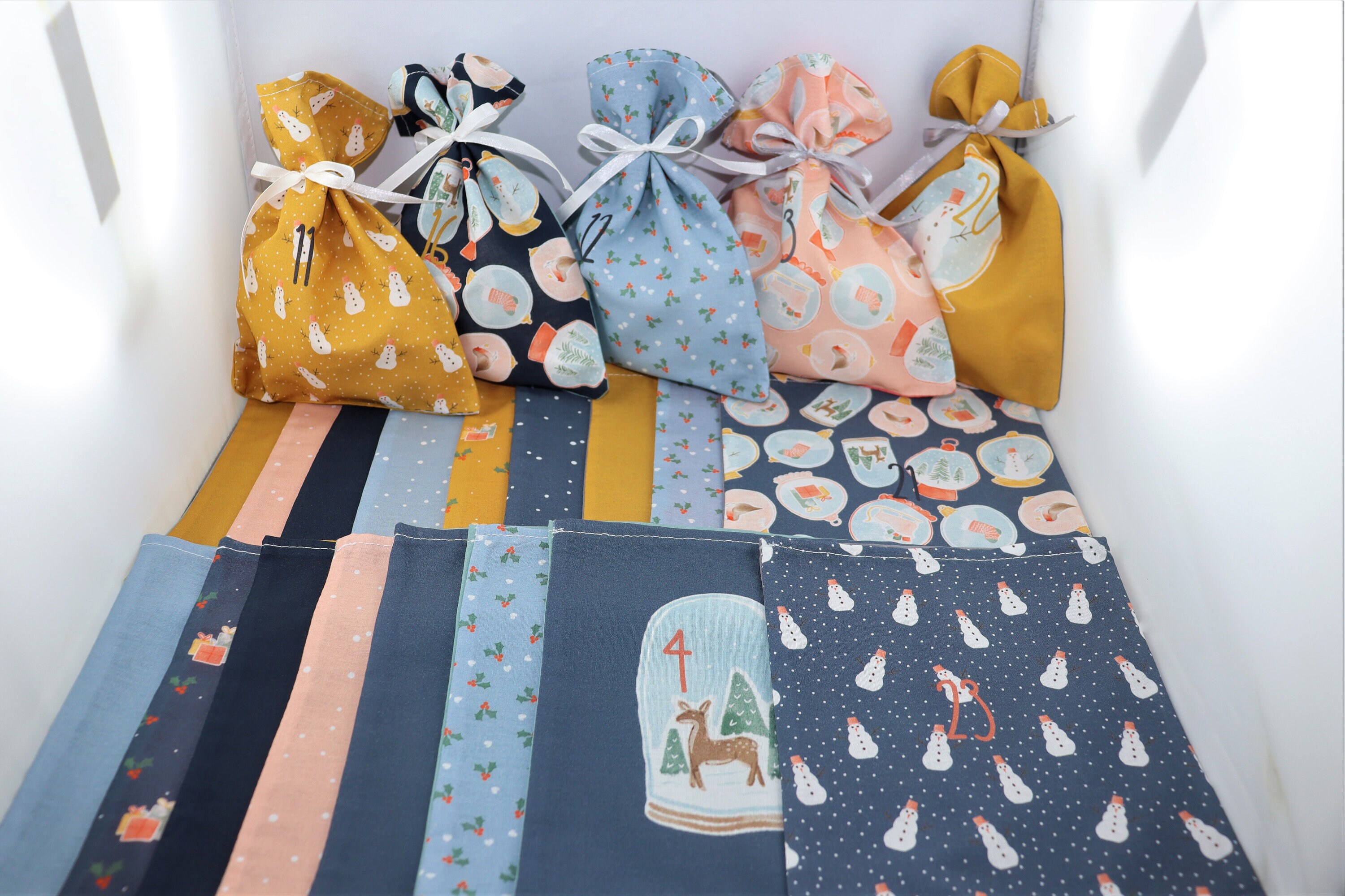 New!! Advent calendar approx. 15 x 19.5 cm blue, 24 printed bags, plus a bag 15 x 28 cm for storage, Advent calendar to fill.