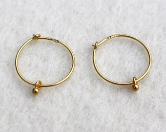 noble 750 gold wire earrings with solid gold beads