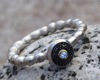 silver bead ring with granulated lens and brilliant