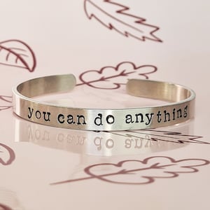 May include: Silver bracelet with the inscription "you can do anything".