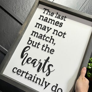 The last names may not match, but the hearts certainly do, blended family, family home decor, wood framed sign