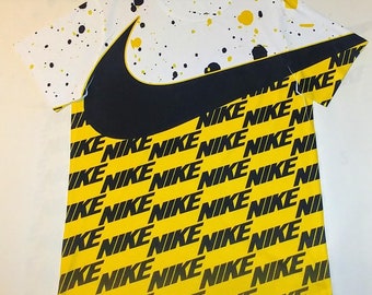 black and yellow nike shirt