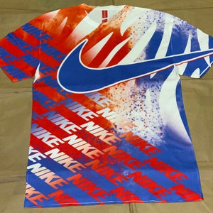 red white and blue nike shirt