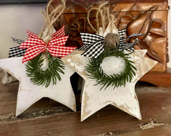 Star wood ornament 4” made from wood, ribbon. Greenery and a bell depending on style. Great for a gift for teachers, friends, presents