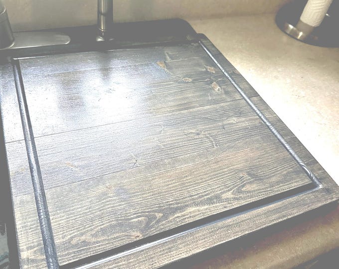 Kitchen sink cover for half of double sink with drip edge