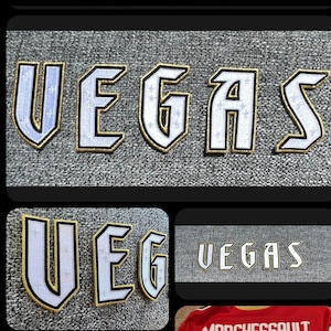 May include: A red hockey jersey with black and gold accents. The jersey has the Vegas Golden Knights logo on the front and the text "Vegas" on the bottom. The back of the jersey has the number "81" and the text "Marchessault" above the number. The text "Vegas" is also on the back of the jersey below the number.