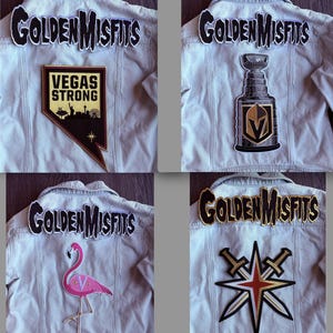 May include: Four light-wash denim jackets, each featuring a large embroidered 'GOLDEN MISFITS' patch across the upper back. Lower patches include a 'VEGAS STRONG' shield, a hockey trophy, a pink flamingo with a 'V', and a gold star with crossed swords.