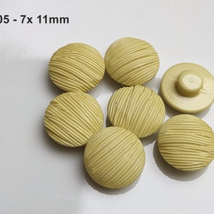 small, yellow plastic buttons to choose from 10 mm to 13 mm GK05 - 7x 11mm