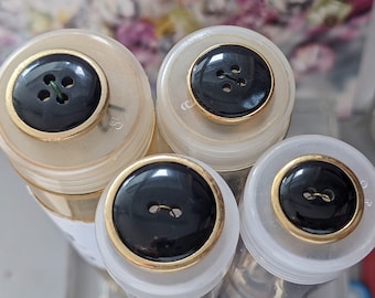 7x botones nobles negros - borde dorado - 18 mm a 23 mm - plástico