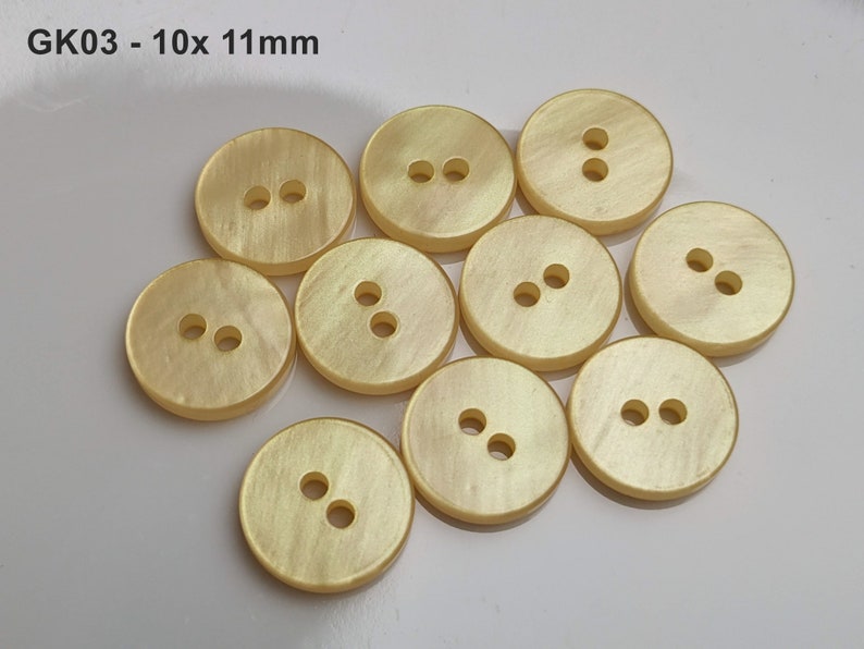 small, yellow plastic buttons to choose from 10 mm to 13 mm GK03 - 10x 11mm